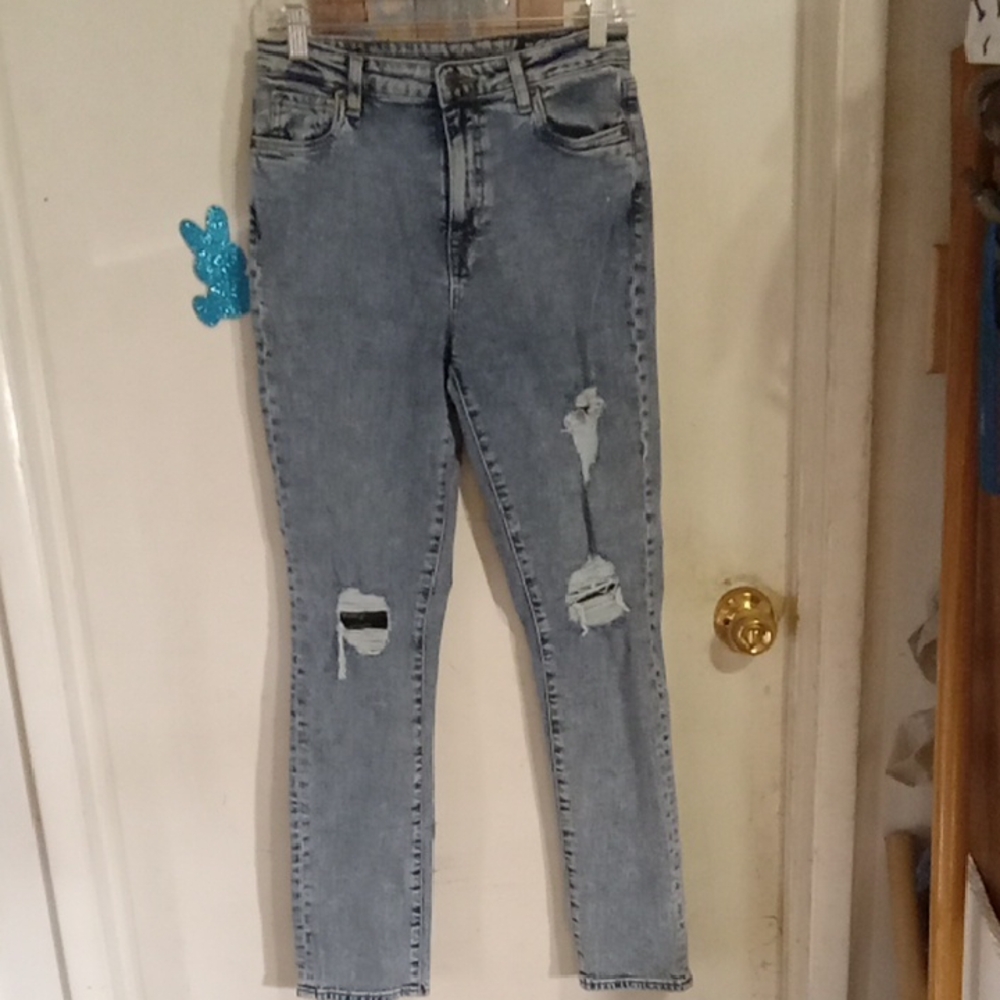 Woman's very distressed jeans blue. Size 29. Buffalo.